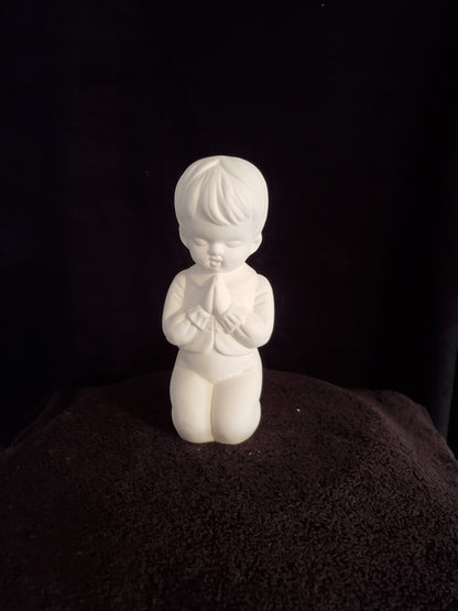 Kneeling Praying Boy image 0